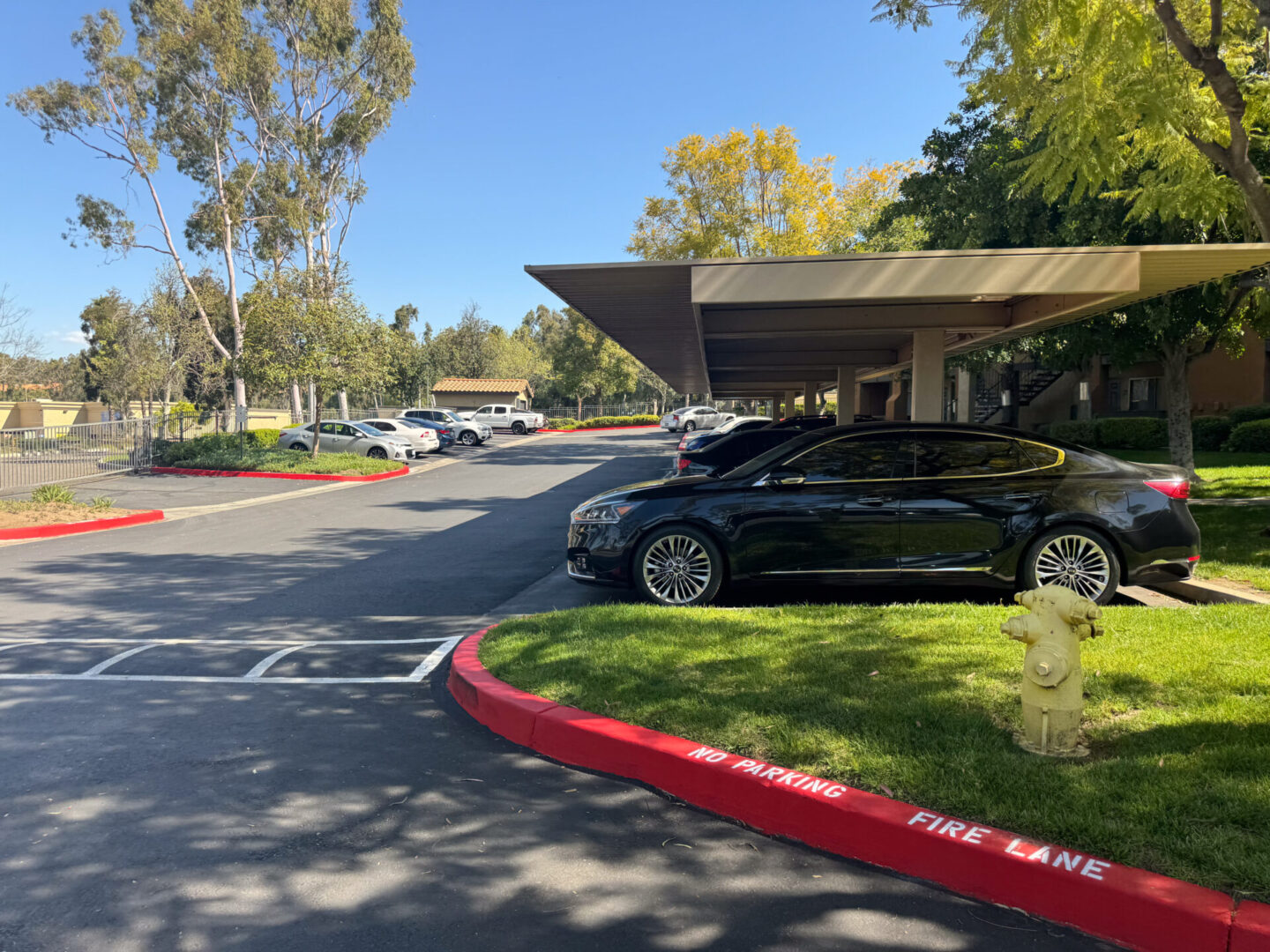 Some cars parked on the side of a road