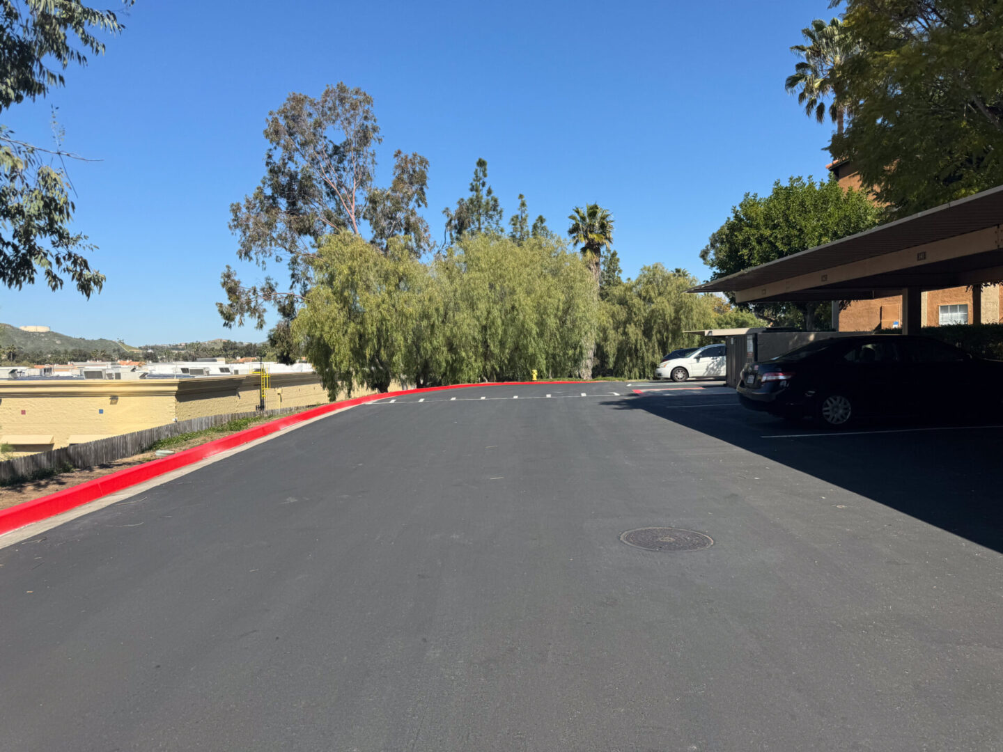 A black color plain street with cars